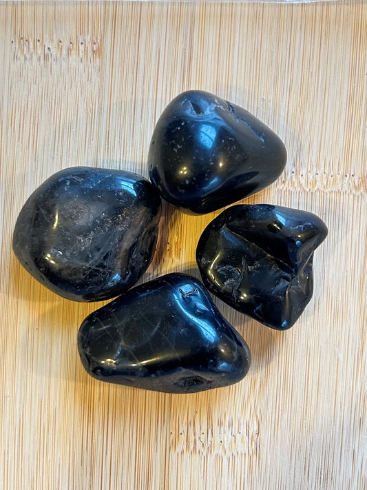 Natural polished Black Onyx crystal with a deep black finish.