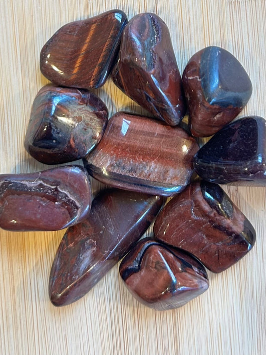Natural Red Tiger's Eye displaying rich mahogany colouring with a silky cat's-eye shimmer.